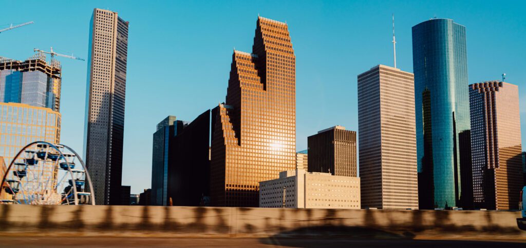 Houston Energy Forum Houston Downtown in sunlight with blue sky